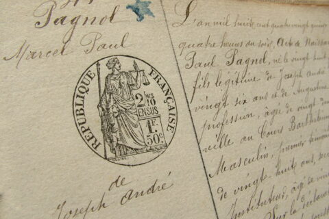 Partie de l'acte de naissance de Marcel Pagnol. Dans la marge, le nom Pagnol Marcel Paul de Joseph André avec le tampon République Française